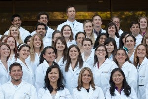 The class of 2015 UC Davis veterinary students have their White Coat Ceremony at the end of their first week of orientation where they're presented with their white coats and recite the veterinarian's oath. 